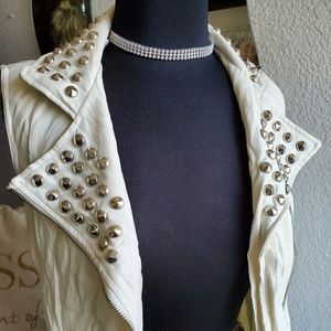 White leather studded vest.